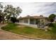 Charming home with a screened-in porch, complemented by well-maintained desert landscaping and an inviting curb appeal at 18607 N 125Th Ave, Sun City West, AZ 85375