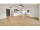 Open floor plan featuring wood-look tile, bright decor, and modern lighting at 18607 N 125Th Ave, Sun City West, AZ 85375