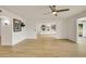 Open living area showcasing beautiful floors, white walls, and seamlessly flowing floorplan at 18607 N 125Th Ave, Sun City West, AZ 85375