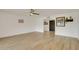Bright living room featuring wood-look tile flooring and neutral decor at 18607 N 125Th Ave, Sun City West, AZ 85375