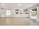 Bright living area featuring custom cabinetry and wood-look tile floors at 18607 N 125Th Ave, Sun City West, AZ 85375