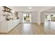 Living area featuring custom cabinetry and an adjacent exterior patio at 18607 N 125Th Ave, Sun City West, AZ 85375