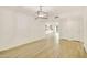 Bright living area with a modern light fixture and views to other rooms at 18607 N 125Th Ave, Sun City West, AZ 85375