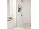 Shower with shelving niche and glass door at 18607 N 125Th Ave, Sun City West, AZ 85375