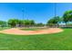Well maintained baseball field provides a recreational area in a green community at 20289 N 259Th Ave, Buckeye, AZ 85396