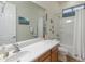 Clean bathroom featuring a vanity, large mirror, and a shower-tub combination with white fixtures at 20289 N 259Th Ave, Buckeye, AZ 85396