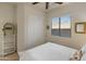 Cozy bedroom featuring a window with natural light, closet, and shelving unit for storage at 20289 N 259Th Ave, Buckeye, AZ 85396