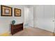 Bedroom with a closet, a small table with plants, and artwork on the walls at 20289 N 259Th Ave, Buckeye, AZ 85396