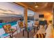 Inviting covered patio with comfortable seating area overlooking a sparkling pool and mountain views at 20289 N 259Th Ave, Buckeye, AZ 85396