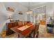 Elegant dining area with a wood table, chandelier lighting, and attractive decor at 20289 N 259Th Ave, Buckeye, AZ 85396
