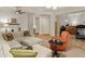 Comfortable living room with recessed lights and furniture, connecting to a room with fitness equipment at 20289 N 259Th Ave, Buckeye, AZ 85396