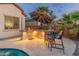 Inviting outdoor kitchen featuring a built-in grill, bar, and ample counter space at 20289 N 259Th Ave, Buckeye, AZ 85396