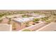 Community school with multiple buildings, parking, and green spaces for students to enjoy at 20289 N 259Th Ave, Buckeye, AZ 85396
