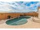 Inviting pool features a rock waterfall, desert landscape and clear water with relaxing lounge chairs at 20289 N 259Th Ave, Buckeye, AZ 85396