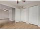 An empty bedroom shows the nice, wood floor and a closet space at 2301 E University Dr # 393, Mesa, AZ 85213