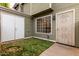 Inviting entrance to a home with a secure gate, well-maintained lawn, and convenient storage at 2301 E University Dr # 393, Mesa, AZ 85213