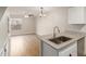 Open kitchen and living space boasting stainless appliances, granite counters and ceiling fan at 2301 E University Dr # 393, Mesa, AZ 85213