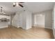 Spacious and bright open-concept area with hardwood floors, ceiling fan, and eat-in kitchen at 2301 E University Dr # 393, Mesa, AZ 85213