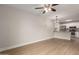 Open concept living room featuring wood floors, recessed lighting, and access to the kitchen at 2301 E University Dr # 393, Mesa, AZ 85213