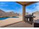 Backyard patio with grill and swimming pool at 23728 W Magnolia Dr, Buckeye, AZ 85326