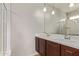 Bathroom with double sink vanity and shower with glass door at 23728 W Magnolia Dr, Buckeye, AZ 85326
