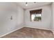 Neutral-toned bedroom with plush carpet, window with blinds and a ceiling fan at 23728 W Magnolia Dr, Buckeye, AZ 85326