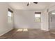 Bedroom featuring carpet floors, neutral paint, and ample natural light from two windows at 23728 W Magnolia Dr, Buckeye, AZ 85326