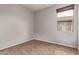 Neutral bedroom with beige carpet and window at 23728 W Magnolia Dr, Buckeye, AZ 85326