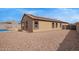 The exterior features a low-maintenance yard, solar panels, and a covered patio at 23728 W Magnolia Dr, Buckeye, AZ 85326