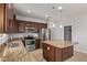 A spacious kitchen with stainless steel appliances, granite countertops, and center island at 23728 W Magnolia Dr, Buckeye, AZ 85326