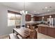 Bright kitchen with wood cabinets, granite countertops and an island at 23728 W Magnolia Dr, Buckeye, AZ 85326