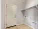 Clean laundry room featuring tile floor and storage at 23728 W Magnolia Dr, Buckeye, AZ 85326