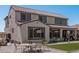 Back exterior of home showcases a well-kept yard, ample space, patio and a light post at 2377 S 245Th Dr, Buckeye, AZ 85326