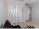 Bedroom with a large wardrobe with doors at 2377 S 245Th Dr, Buckeye, AZ 85326