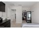 Spacious bedroom featuring an open closet and view to other rooms at 2377 S 245Th Dr, Buckeye, AZ 85326