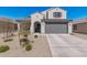 Charming single-Gathering home with a well-maintained desert landscape and a spacious two-car garage at 2377 S 245Th Dr, Buckeye, AZ 85326