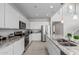 Spacious kitchen with granite countertops, stainless steel appliances, a large center island, and ample cabinet space at 2377 S 245Th Dr, Buckeye, AZ 85326