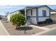 Inviting home with covered entryway, manicured yard, and well-maintained landscaping at 2650 W Union Hills Dr # 230, Phoenix, AZ 85027