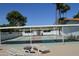 Shuffleboard courts with lounge chairs and tables under a shaded pergola area at 2650 W Union Hills Dr # 230, Phoenix, AZ 85027