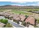Aerial image of desert homes showcasing proximity to the community golf course and scenic mountain views at 27926 N 130Th Ave, Peoria, AZ 85383