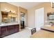 The primary bath boasts dual sinks, custom cabinets, tile floors and a makeup vanity at 27926 N 130Th Ave, Peoria, AZ 85383