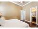 Bedroom boasts hardwood floors and an en suite bathroom at 27926 N 130Th Ave, Peoria, AZ 85383