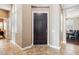Elegant foyer with tile flooring and dark wood front door at 27926 N 130Th Ave, Peoria, AZ 85383