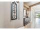Hallway with accent table and mirror, leading to bright rooms at 27926 N 130Th Ave, Peoria, AZ 85383