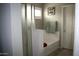Bright bathroom featuring a tub, shower, and decorative towel at 2917 S 121St Ln, Tolleson, AZ 85353