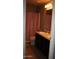 Bathroom featuring a double vanity, dark wood cabinets, and a shower with a pink curtain at 2917 S 121St Ln, Tolleson, AZ 85353