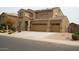 Charming two-story home with a three-car garage and low-maintenance desert landscaping at 2917 S 121St Ln, Tolleson, AZ 85353