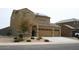 Beautiful home boasting a terracotta roof, large driveway, and xeriscaped front yard at 2917 S 121St Ln, Tolleson, AZ 85353