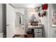 Bright hallway featuring a vanity with granite countertops, storage, and decor at 3109 W Loma Ln, Phoenix, AZ 85051