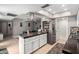 Open kitchen featuring a breakfast bar, stainless steel appliances, and ample countertop space at 3109 W Loma Ln, Phoenix, AZ 85051